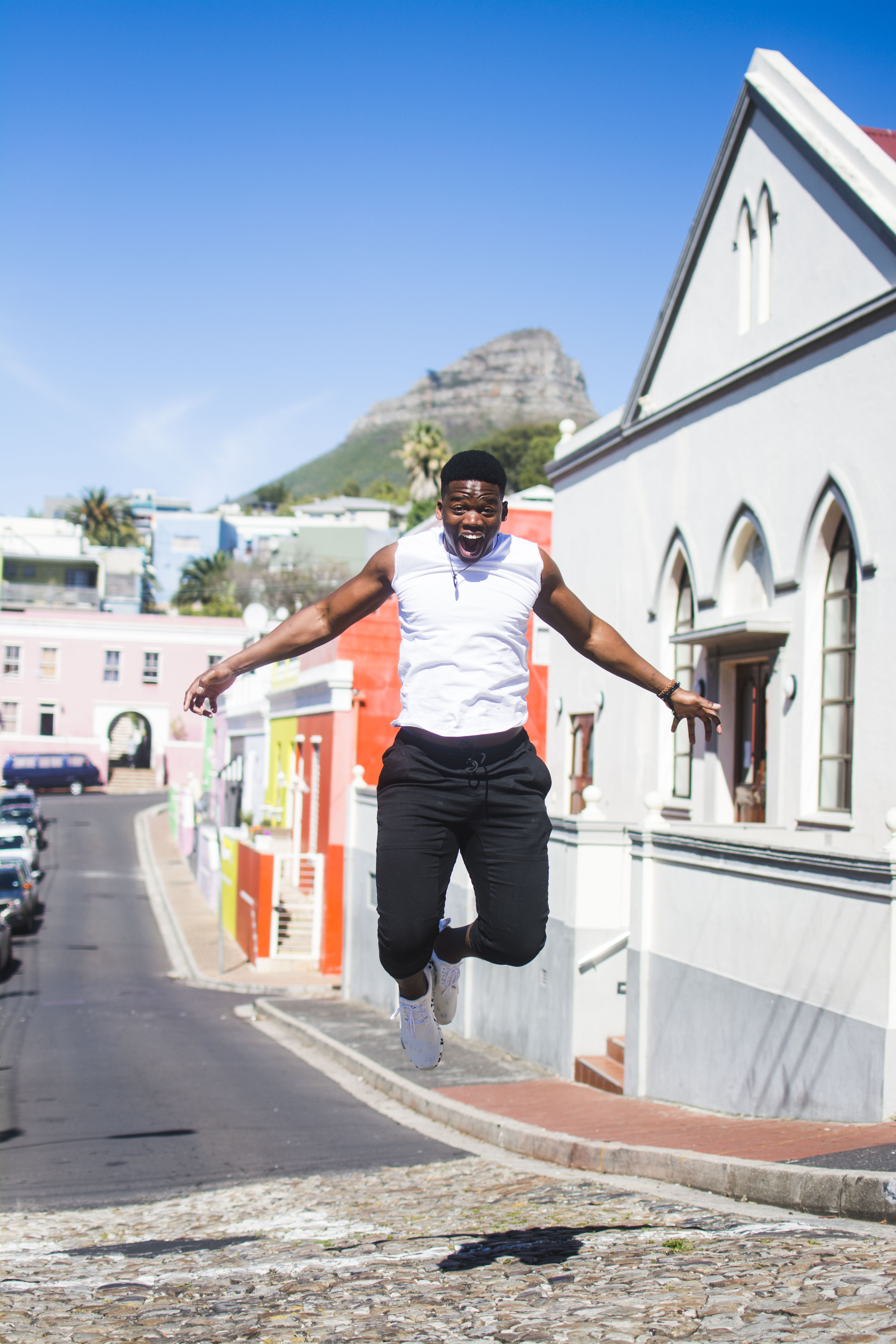 Takudzwa jumping on a mountain